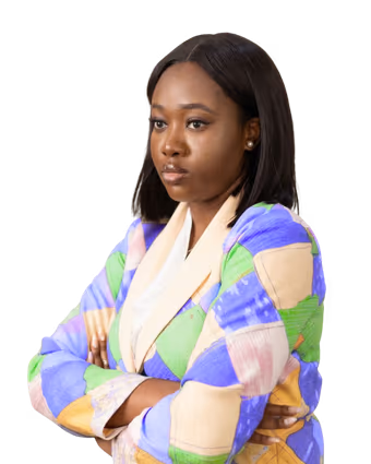 Jasmine-Jade with arms folded, wearing a colourful patchwork blazer
